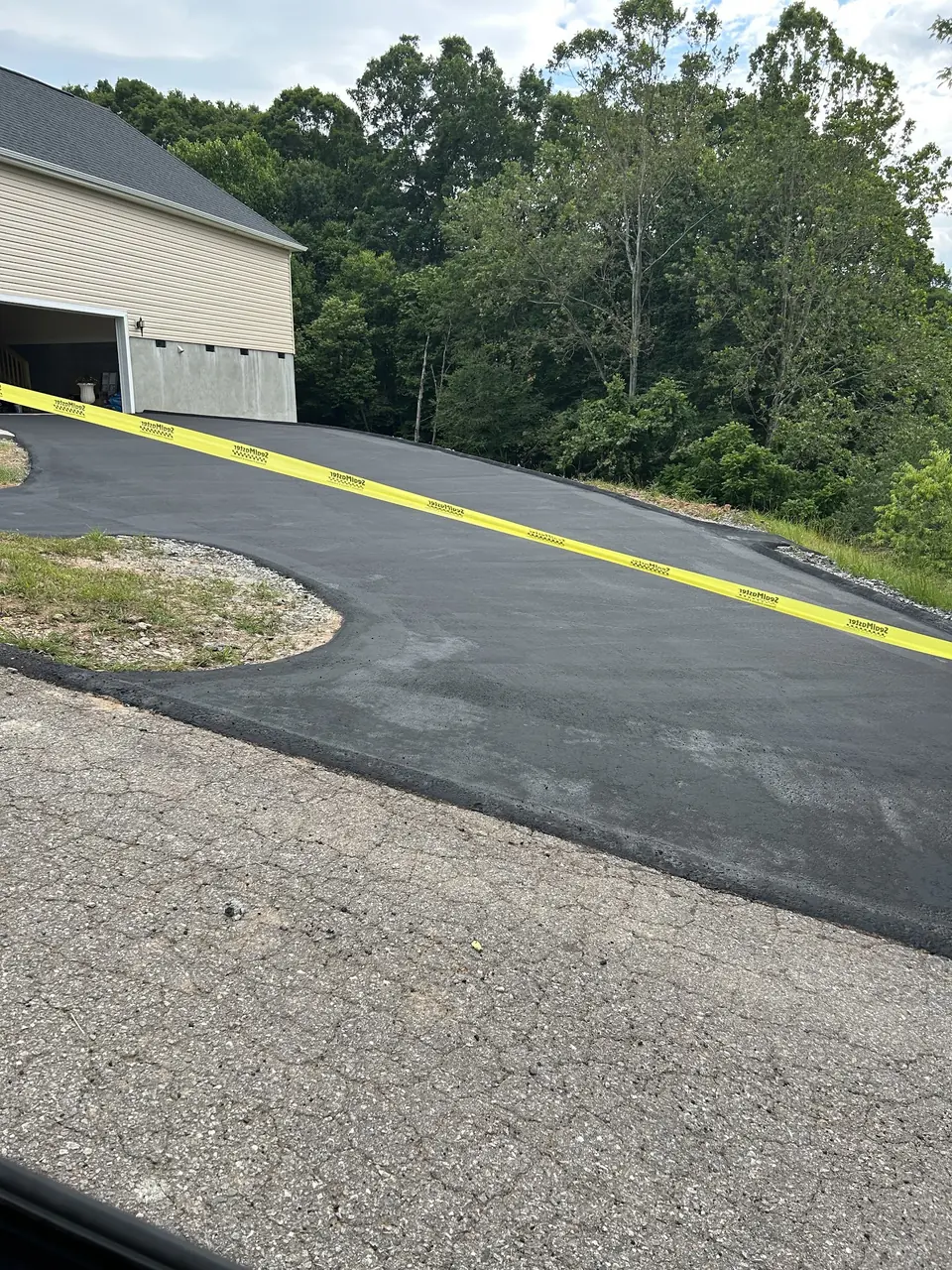 New asphalt laid where the gravel used to be