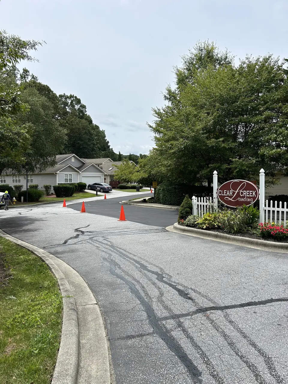 A paved subdivision road with fresh cones out